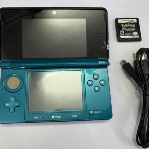 Nintendo 3ds with Pokemon Black game and USB cable on
